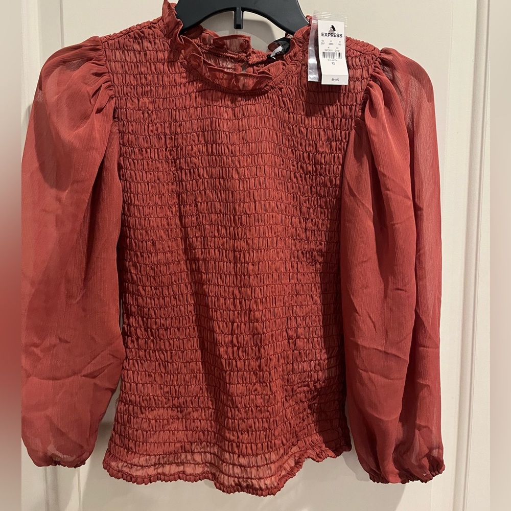 Red Express long sleeve top in size xs with tags still on